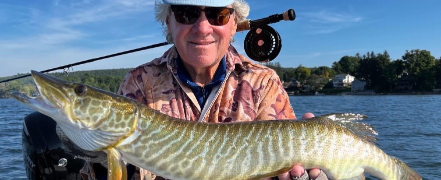 fly fishing ny man holding fish caught fly fishing in upstate ny