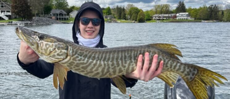 finger lakes fishing in new york holding fish